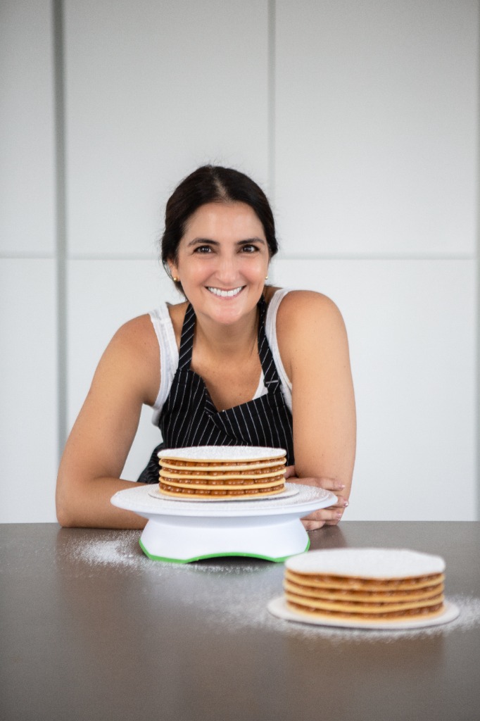 toutsweet: founder with freshly baked alfajores in her kitchen